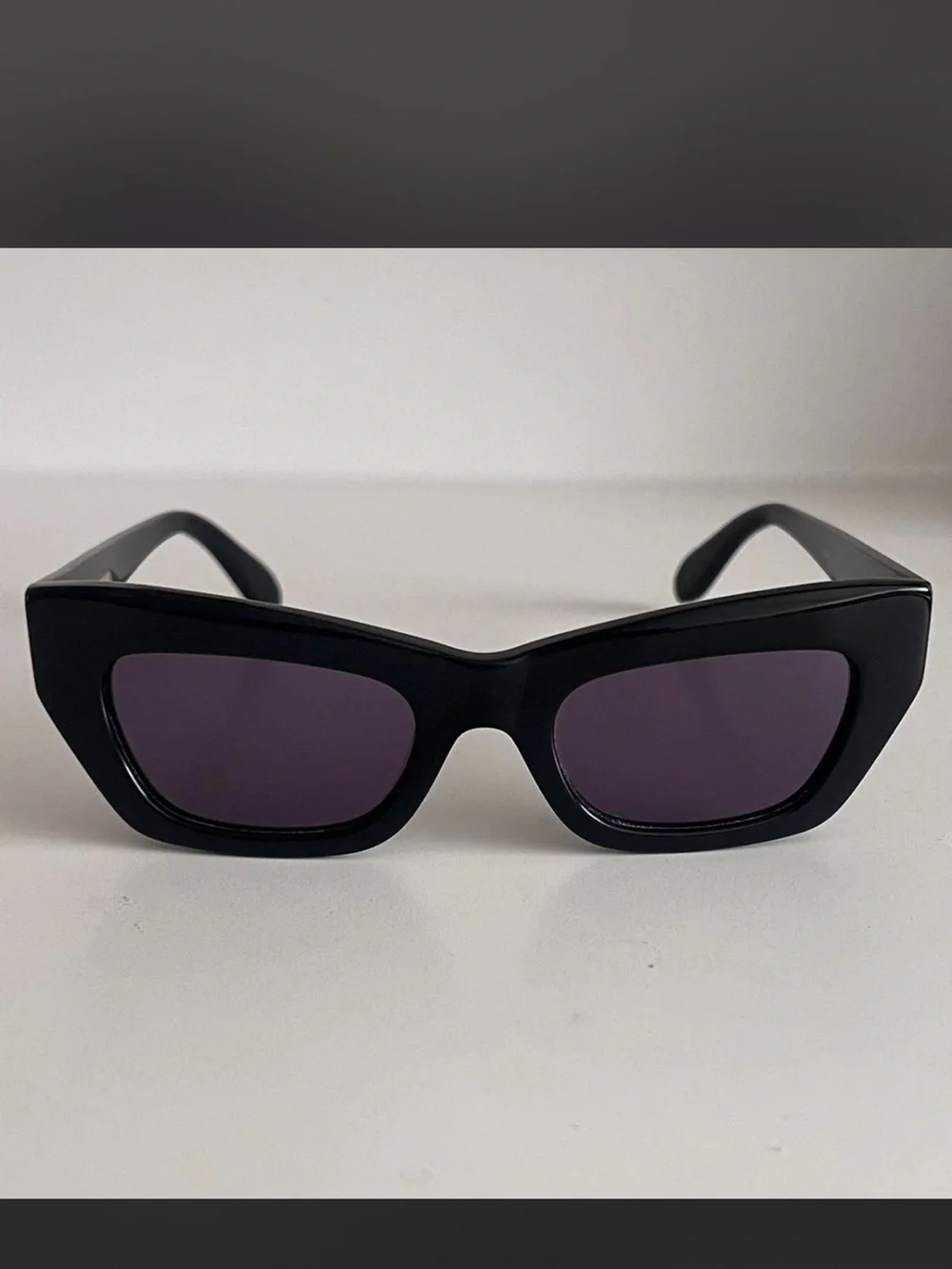 BCBGMaxAzria Black Frame Sunglasses with Dark Purple Lenses